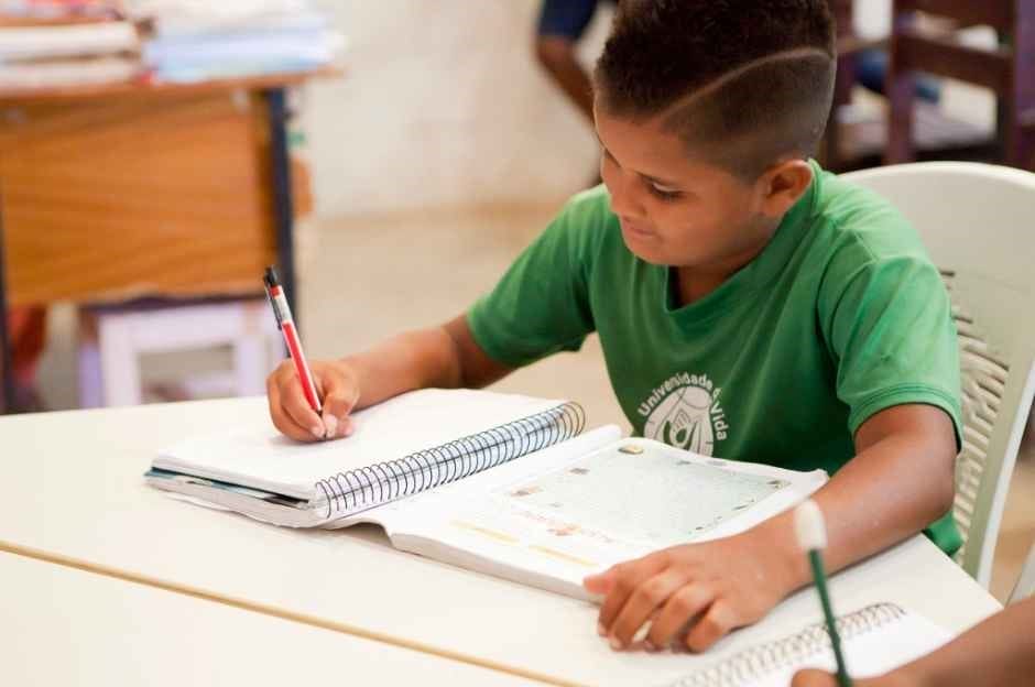 boy in classroom doing homework