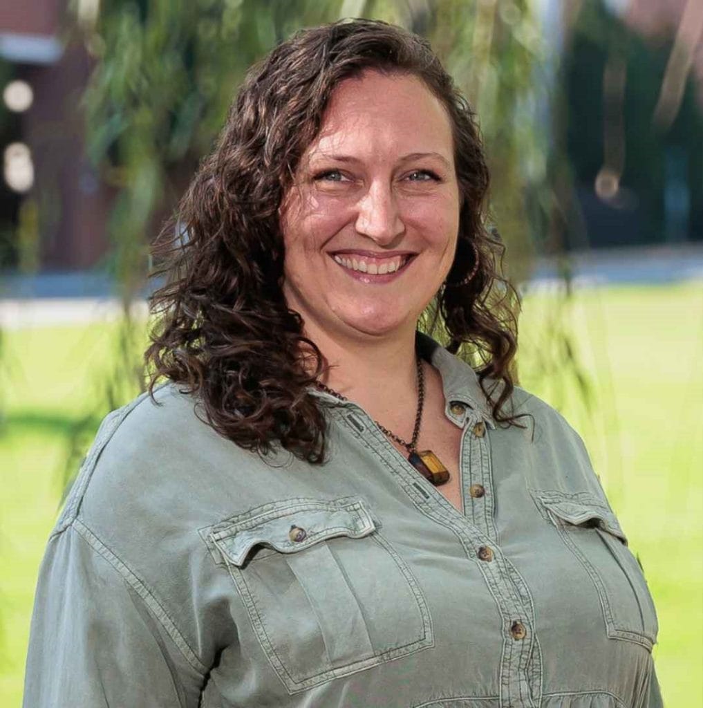 Celest in front of weeping willow