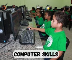 young children in computer classroom using computers