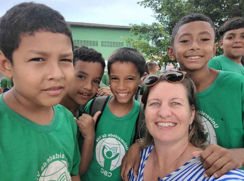 female volunteer with group of boys