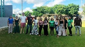 staff team in brazil in front of gym
